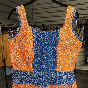 Sleeveless short peplum African print